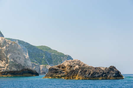 rocky coast of greek island and sea view, landscape greece view from boatの写真素材