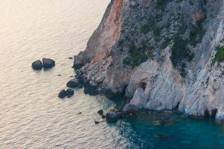 coastline with sea, mountains, canyon and cliffs with sunset light, Greeceの写真素材