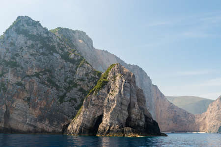 rocky coast of greek island and sea view, landscape greece view from boatの写真素材