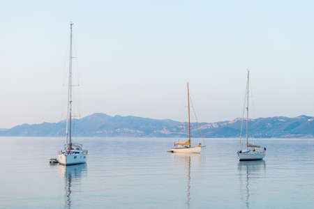 Sailing Yacht from sail regatta on mediterranean sea at sunsetの写真素材