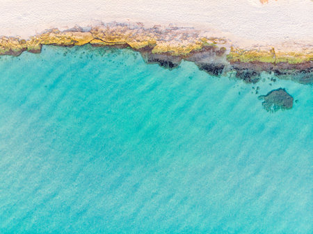 top view of turquoise sea and sandy beachの写真素材