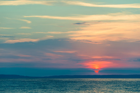 Evening sky with dramatic clouds over the sea. Dramatic sunset over the sea.の写真素材