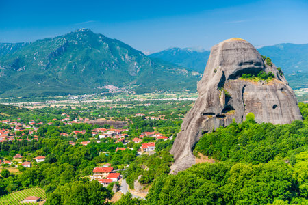 Huge gray rocks Meteors in Greece among green mountain forestの写真素材