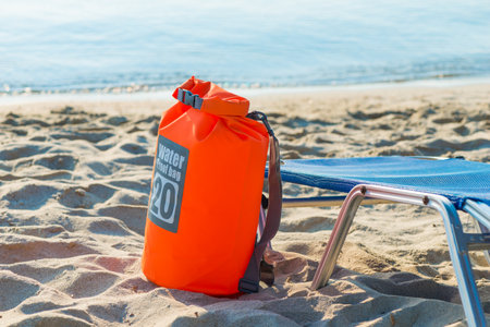water proof bag on the sand beachの写真素材