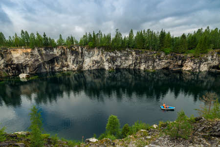 Boats on Marble Lake in Ruskeala Mountain Park in Karelia Russiaの写真素材