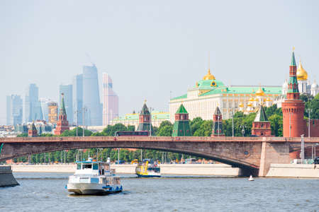 View of the Kremlin and skyscrapers Moscow City from the pleasure ship on the Moskva river, Russiaの写真素材