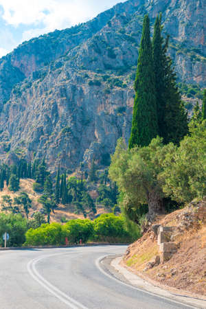 Highway road in the mountains, rocks on both sides with mountains in the background, Greeceの写真素材