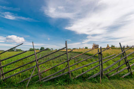 Wooden fence of the farm, made in the peoples of the Russian tradition of the northの写真素材