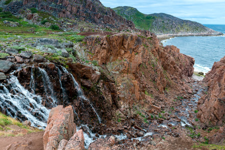 Mountain waterfall in the North of the Kola Peninsula. Waterfall in stone rocksの写真素材