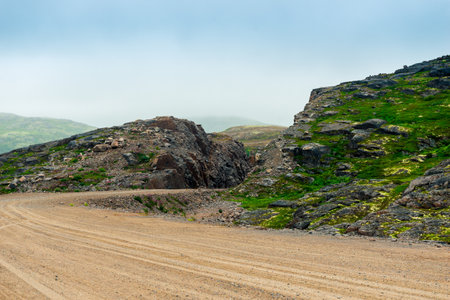 Grader road in the rocks of the tundra of the Kola Peninsula. Russiaの写真素材