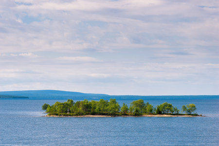 Wild rocky island in the cold waters of the northern lakeの写真素材