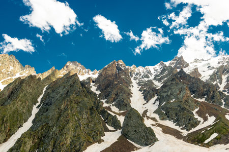Snow in the hollow of the high rocky mountains of the Fairy Glacier in the mountains of the northern...