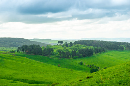 A picturesque landscape with green hills and forest in the foothills of Elbrus. Russiaの写真素材
