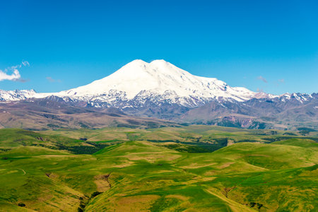 Picturesque view of the white peak of Mount Elbrus. View from the Kanjol plateauの写真素材