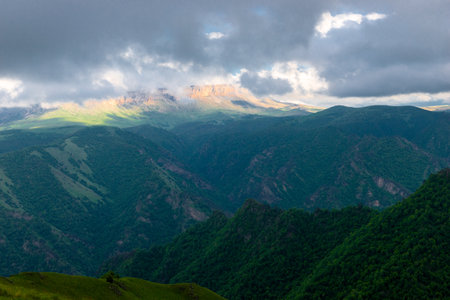 Dramatic landscape with hurricane clouds over the plateau in a mountainous area in bad weatherの写真素材