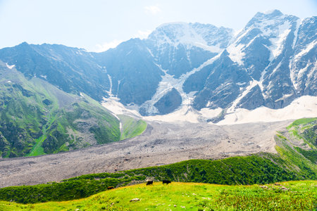 Impressive view of the rocky slope with the glacier "seven" and its moraine. Caucasus Mountainsの写真素材