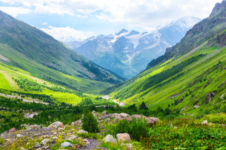 Beautiful high mountain landscape with green slopes and large stones. Caucasus, Elbrus region.の写真素材