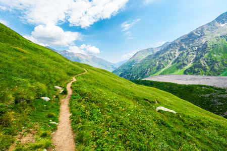 Beautiful view with a walking path on a mountainside high in the Caucasus Mountainsの写真素材