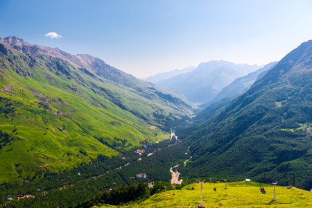 Beautiful picturesque view of a mountain gorge among green mountains in good weatherの写真素材