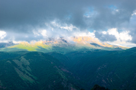 Dramatic landscape with black hurricane clouds over the Kanjol plateau in a mountainous area in bad weatherの写真素材