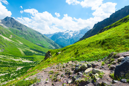 Beautiful high mountain landscape with green slopes and large stones. Caucasus, Elbrus region.の写真素材