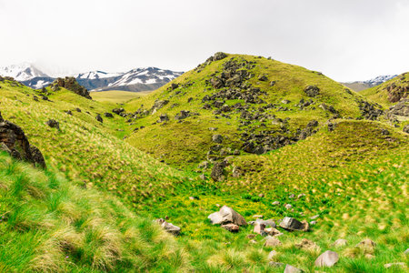 A mysterious landscape with green mountains and rocks near the Emmanuel Valley and the Elbrus regionの写真素材