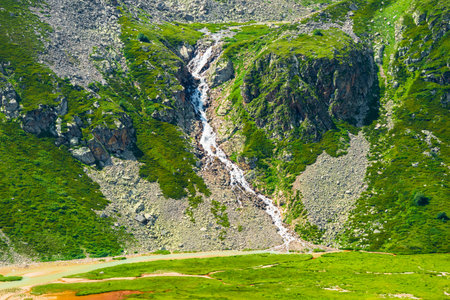 Picturesque mountain waterfall in harsh rocky terrain. Caucasusの写真素材