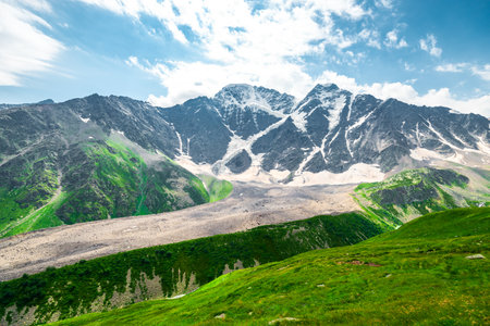 Picturesque mountain landscape with a view of the glacier "seven" and a mountain lake. Caucasus Mountainsの写真素材