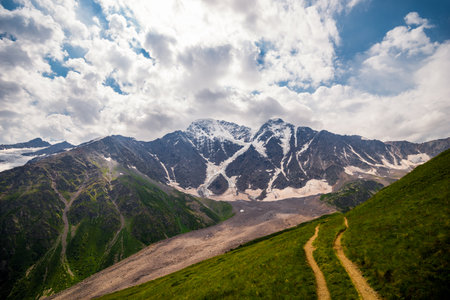 Picturesque view of the glacier seven with a tourist trail in sunny weatherの写真素材