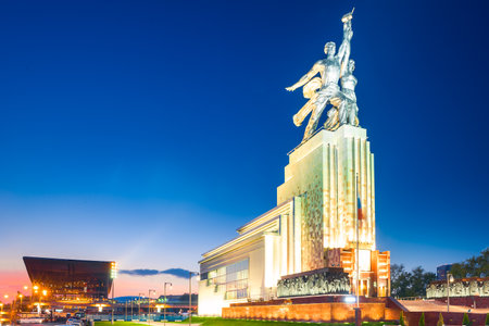 The symbol of the Soviet era is the monument "Worker and collective farmer" in the light of the night city. Moscowの写真素材