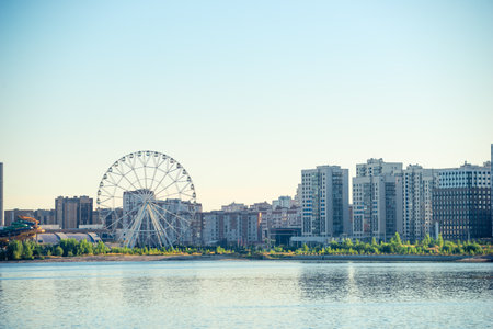 View of the Ferris wheel and the Kazanka river early in the morning in the city of Kazan. Russiaの写真素材