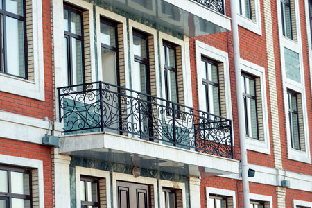 Balcony with black cast iron railing on old European style houseの写真素材