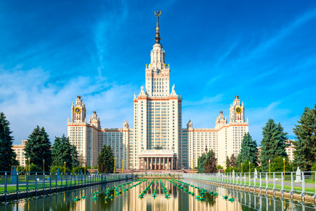Beautiful view of the Stalinist skyscraper of Lomonosov Moscow State University with reflection in the lily fountain. Russiaの写真素材