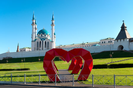 Decorative heart-shaped arches in the park against the backdrop of the Kazan Kremlin and the Kul Sharif Mosque. Kazan, Russiaの写真素材