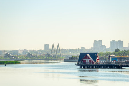 Picturesque view of the river, a coastal house and a cable-stayed bridge. Russiaの写真素材
