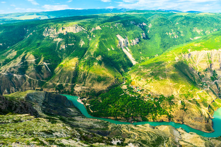 Panoramic landscape of a deep picturesque canyon of the Caucasian mountains of Dagestan and the azure mountain river Sulak. Russiaの写真素材