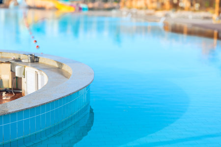 Empty bar counter of the swimming pool with clear azure waterの写真素材