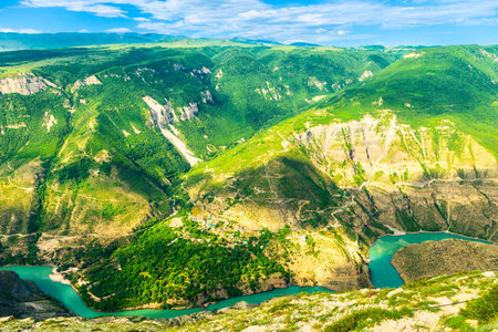 Panoramic landscape of a deep picturesque canyon of the Caucasian mountains of Dagestan and the azure mountain river Sulak. Russiaの写真素材