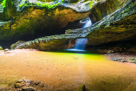 Picturesque underground waterfall Saltinsky and lake in the Caucasus Mountains. Dagestanの写真素材