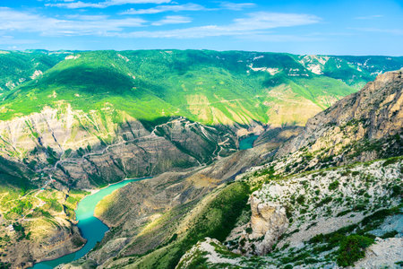 Panoramic landscape of a deep picturesque canyon of the Caucasian mountains of Dagestan and the azure mountain river Sulak. Russiaの写真素材