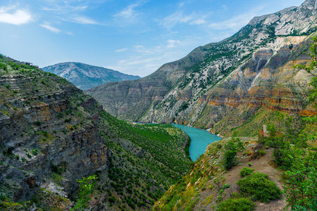 Panoramic landscape of a deep picturesque canyon of the Caucasian mountains of Dagestan and the azure mountain river Sulak. Russiaの写真素材