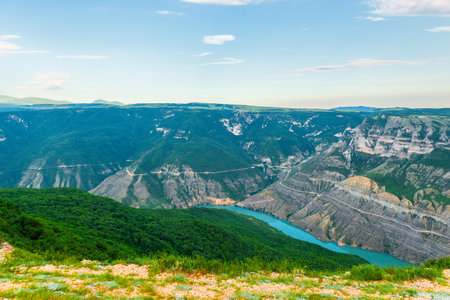 Panoramic landscape of a deep picturesque canyon of the Caucasian mountains of Dagestan and the azure mountain river Sulak. Russiaの写真素材