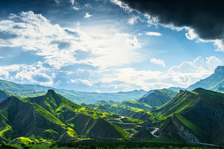 Picturesque mountain landscape with green mountains and dramatic sky. Dagestan, Caucasus