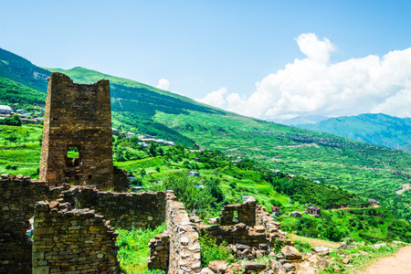 An old watchtower among the ruins of the abandoned mountain village of Kakhib on a mountainside....