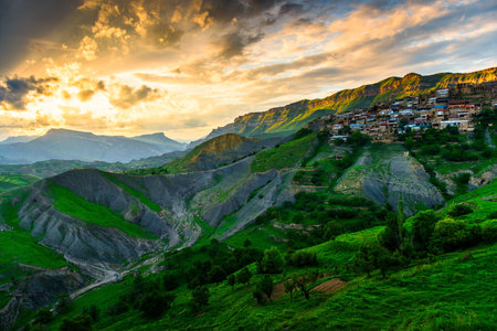 Picturesque landscape of the mountain village Chokh with a stunning sunset sky. North Caucasus