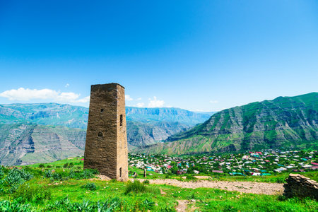 Mountain landscape with an old watchtower over a picturesque canyon.. North Caucasusの写真素材