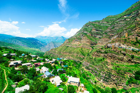 Beautiful view of the mountain village against the slope with ancient ruins of the village of...