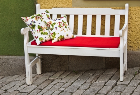 romantic bench with pillows outdoorの写真素材