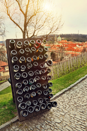 Collection sparkling wines aging in the rack outdoors against old town Prague, Czech Republicの写真素材