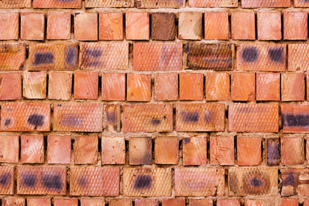 Red brick wall from big blocks, textured backgroundの写真素材